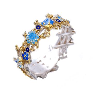 Floraler Bandring mit blauen Wildblumen und vergoldeten Details